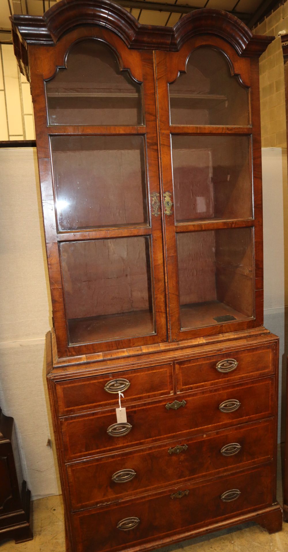 A Queen Anne style walnut glazed cabinet on chest, W.92cm, D.49cm, H.218cm